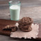 stack of chocolate cookies and a glass of milk