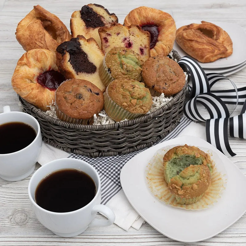 basket of pastries and coffee cups