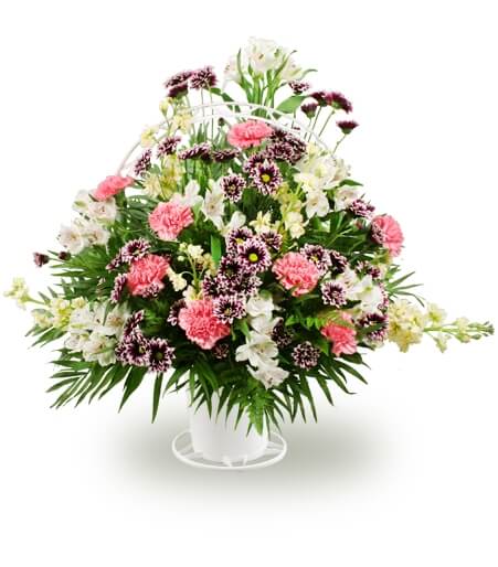 Mixed flowers in a handled basket