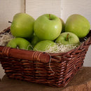 a basket of green apples