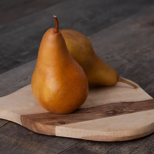 two pears on a cutting board