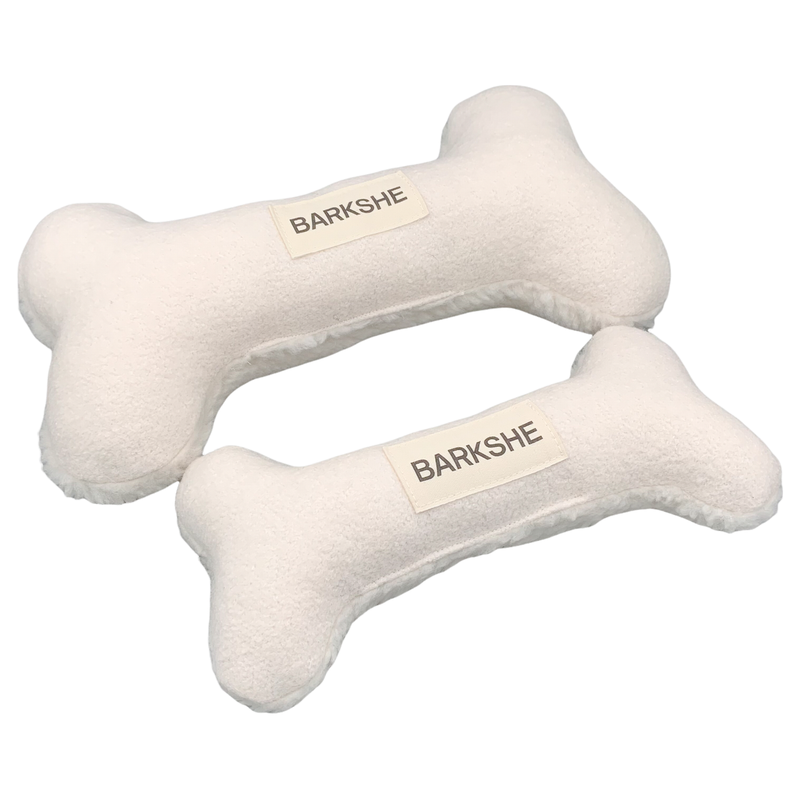 two white bone shape pillows