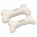 two white bone like pillows with labels on them
