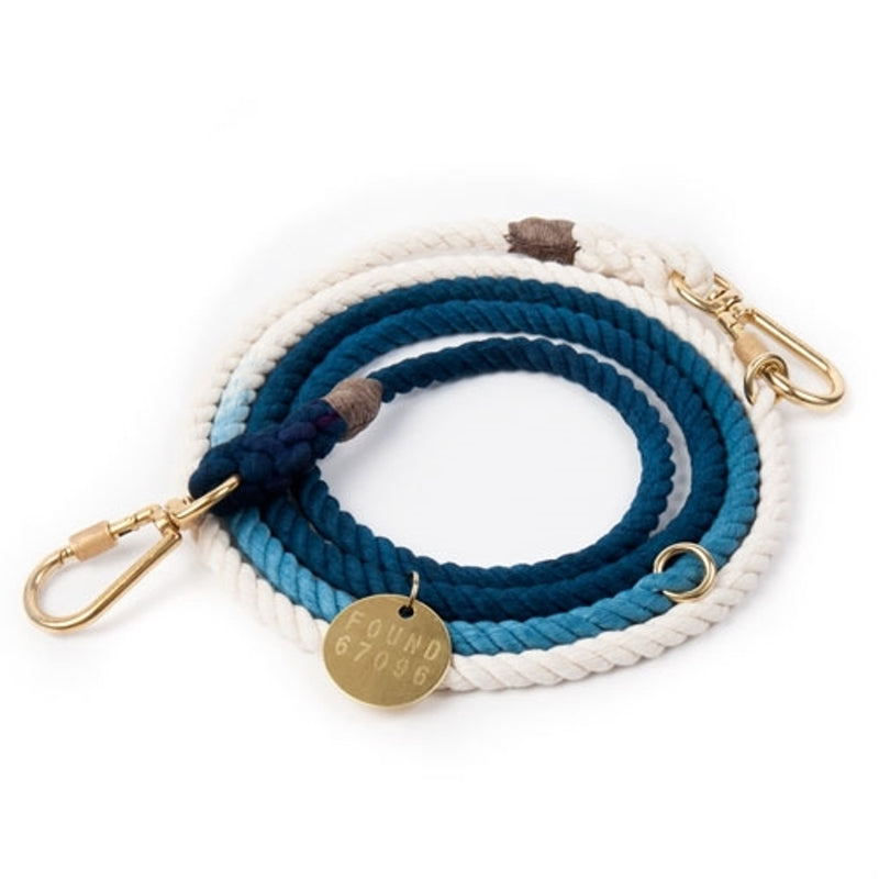 blue and white rope with a gold tag