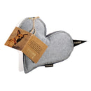 heart shaped pillow with a tag