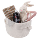 basket with a stuffed animal and a bottle of lemonade