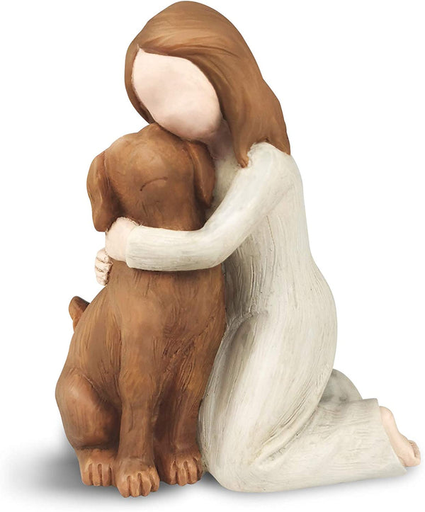 statue of a person hugging a dog