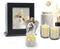 a picture frame with a photo of a cat and two candles and statue of angel