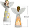 a candle holder with a candle and angel figure with measurements