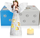 statue of a angel with wings and a candle