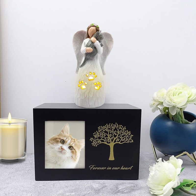 black box with a picture of a cat and a candle and statue