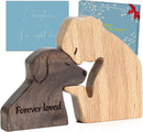 wooden figurine of a dog and a person